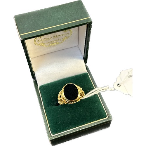 58 - 9ct yellow gold signet ring; pierced and textured gold shank. Black onyx. [Ring size K] [4.42Grams]