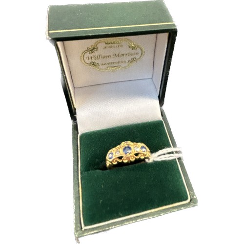 616 - An early 20th century 18ct gold sapphire and diamond set ring, three graduated sapphires set with tw... 