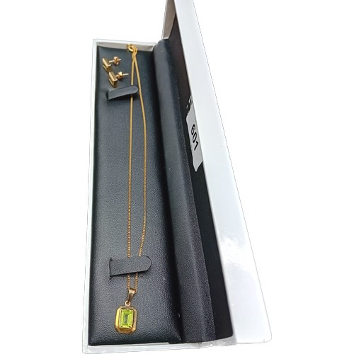 601 - 9ct yellow gold pendant fitted with a green tourmaline stone, 9ct yellow gold necklace and a pair of... 