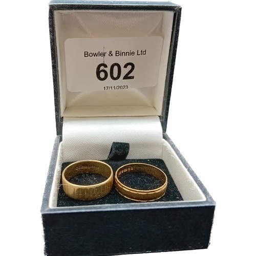 602 - Two 9ct yellow gold wedding bands. [Ring size J & L] [3.52Grams]