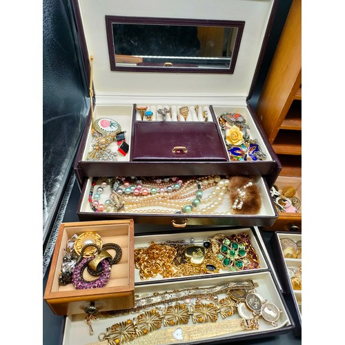 76 - Two jewellery boxes containing a mixed collection of jewellery.