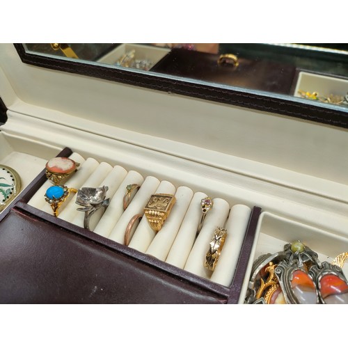 76 - Two jewellery boxes containing a mixed collection of jewellery.