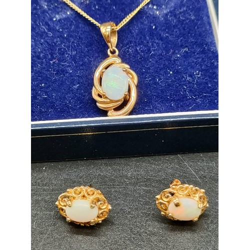 597 - 9ct yellow gold and opal pendant with fitted necklace together with a pair of 9ct yellow gold and op... 