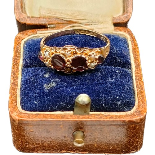 591 - Antique Birmingham 9ct yellow gold ladies ring set with four purple garnets and seed pearls. [Ring s... 