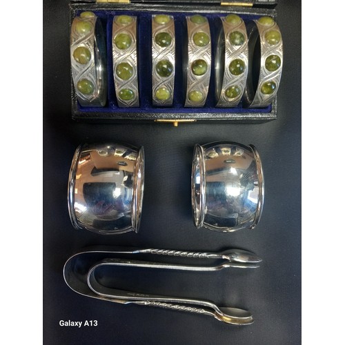 611 - Selection of silver items; Boxed set of six Birmingham silver napkin rings designed with green hards... 