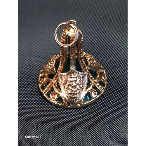 614 - A 9ct gold intaglio fob
The circular green stone carved with a classical armoured head, the gold wor... 