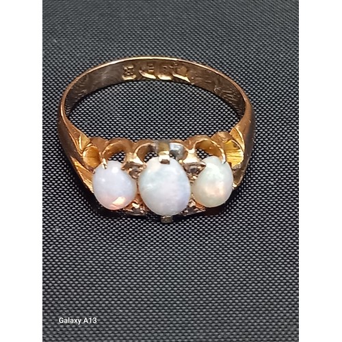 618 - A Victorian 18ct gold opal ring
The graduated oval opals claw set and with small chips between, toge... 