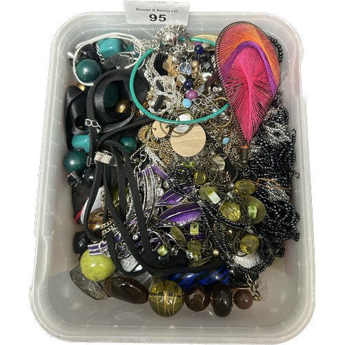 95 - Two tubs of mixed costume jewellery.