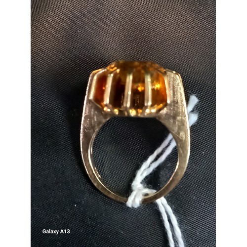 548 - 9ct yellow gold ring set with a multi claw set cushion cut citrine stone. [Ring size L] [8.70Grams]