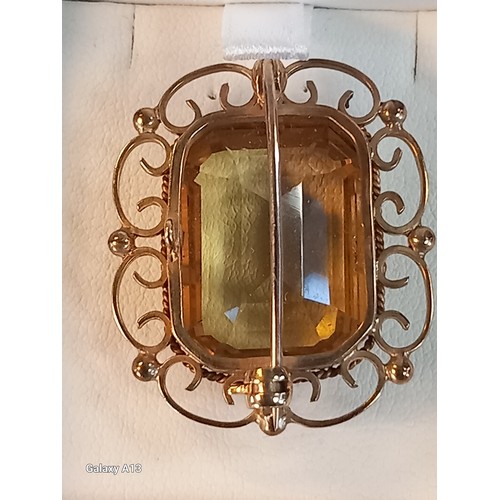 558 - A 9ct yellow gold and citrine set brooch
The gold scrolling and ball frame with rectangular cut citr... 