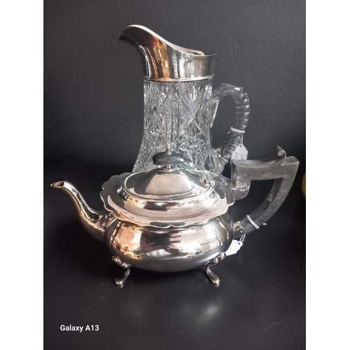 642A - Birmingham silver and cut crystal water jug together with E.P tea pot. [24cm high]