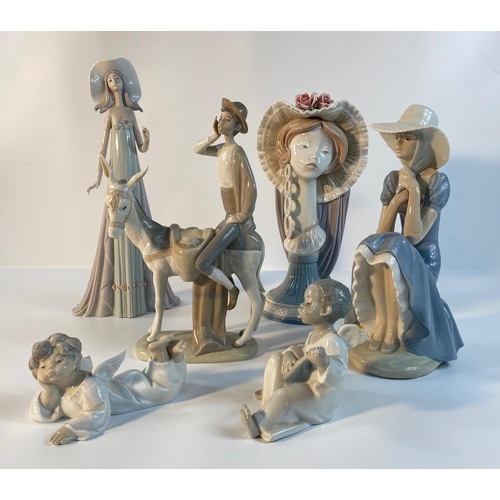 153 - A collection of Lladro figurines; girl head figure with hat, the debutante & others