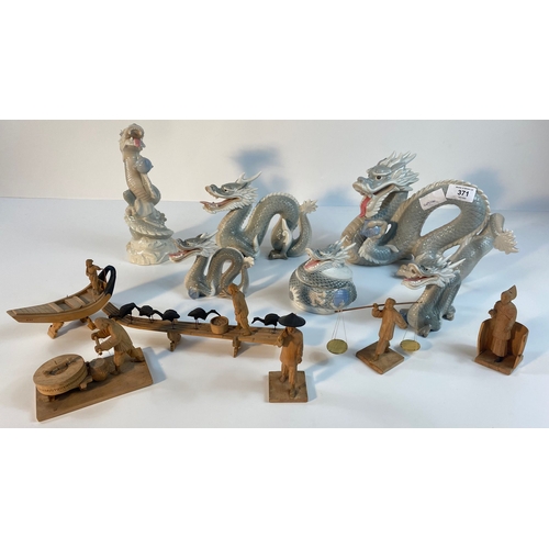 371 - A collection of John Jenkins porcelain dragon figures along with a selection of eastern wooden carve... 