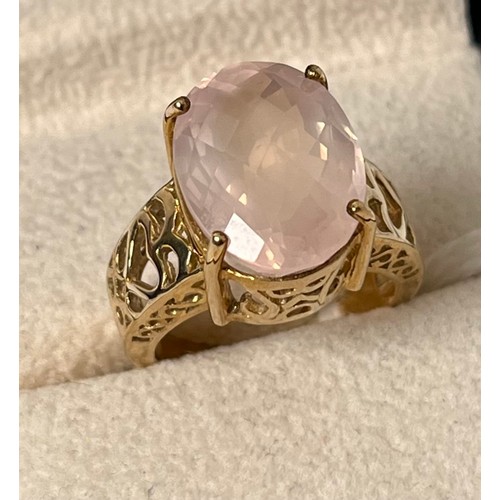 29 - 9ct yellow gold ring set with an oval cut pink gem stone. [Ring size N] [7.32Grams]