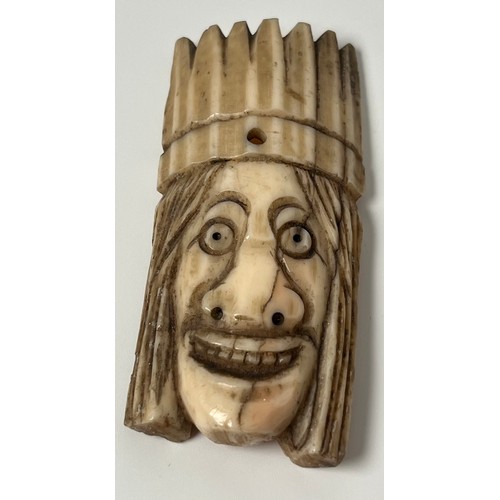 149 - 18th/ 19th century carved scrimshaw carving; possibly of a native American Indian head. [8.5cm in le... 