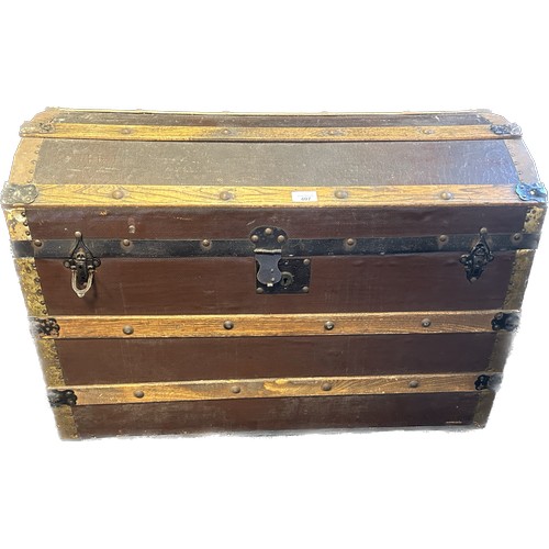 407 - Antique wood and metal bound steamer trunk.