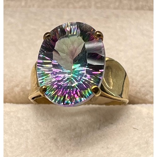 122 - 9ct yellow gold ring set with a purple/ blue and green speckle gem stone. [Ring size N] [4.86Grams]