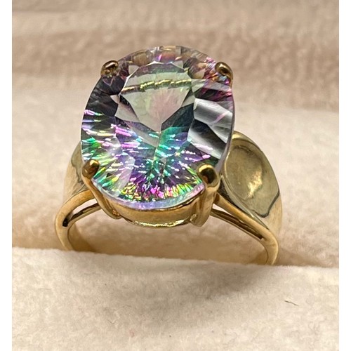 122 - 9ct yellow gold ring set with a purple/ blue and green speckle gem stone. [Ring size N] [4.86Grams]