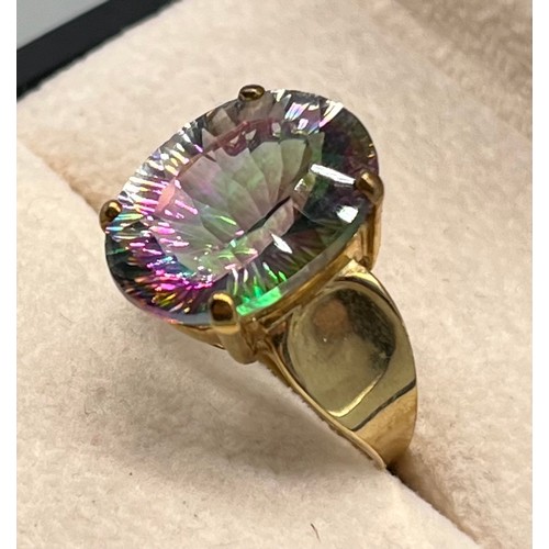 122 - 9ct yellow gold ring set with a purple/ blue and green speckle gem stone. [Ring size N] [4.86Grams]