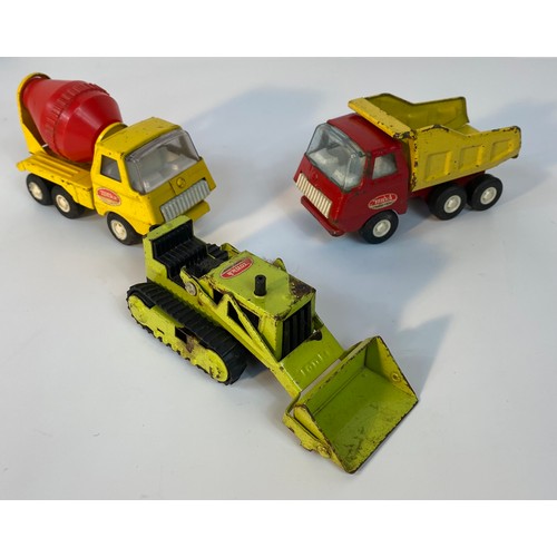 351 - A collection of vintage Tonka vehicles; Tonka Rotating Crane, Tonka T-6 Bulldozer & other vehicles