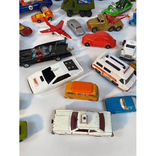 352 - A collection of play worn vehicle's; A Large tin plate police car, Corgi 007 Lotus, 1960s Corgi Batm... 