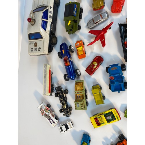 352 - A collection of play worn vehicle's; A Large tin plate police car, Corgi 007 Lotus, 1960s Corgi Batm... 