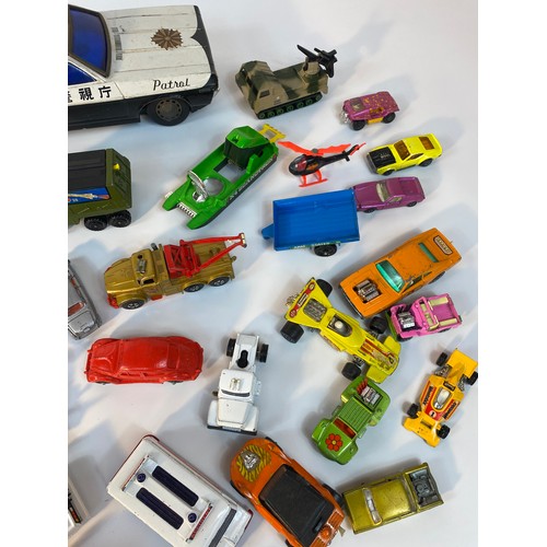 352 - A collection of play worn vehicle's; A Large tin plate police car, Corgi 007 Lotus, 1960s Corgi Batm... 