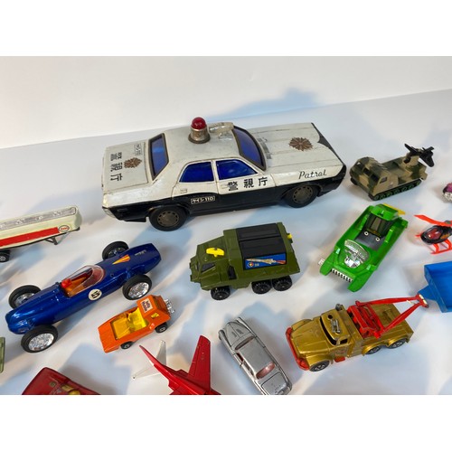 352 - A collection of play worn vehicle's; A Large tin plate police car, Corgi 007 Lotus, 1960s Corgi Batm... 