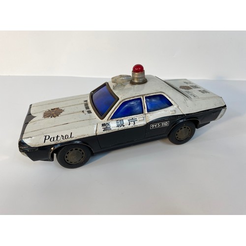 352 - A collection of play worn vehicle's; A Large tin plate police car, Corgi 007 Lotus, 1960s Corgi Batm... 