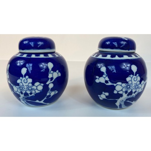 182 - A collection of 3 Chinese lidded prunes ginger jars with covers set in blue background design with f... 