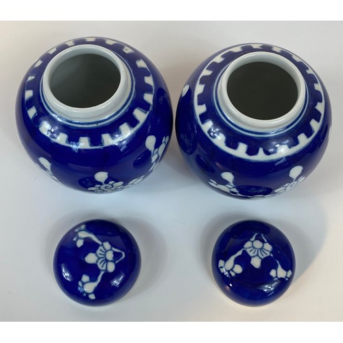 182 - A collection of 3 Chinese lidded prunes ginger jars with covers set in blue background design with f... 