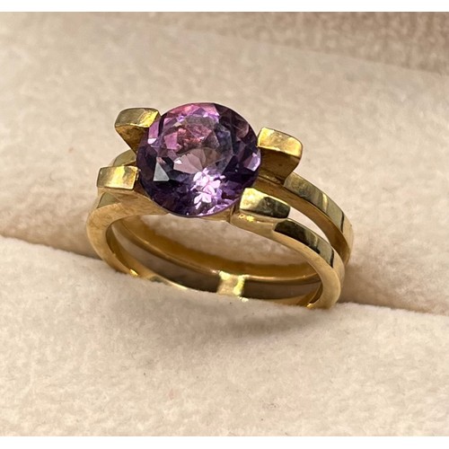 96 - 9ct yellow gold ring set with a round cut Amethyst gem stone. [Ring size M] [4.83Grams]