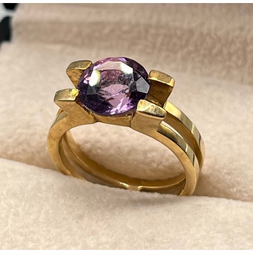 96 - 9ct yellow gold ring set with a round cut Amethyst gem stone. [Ring size M] [4.83Grams]