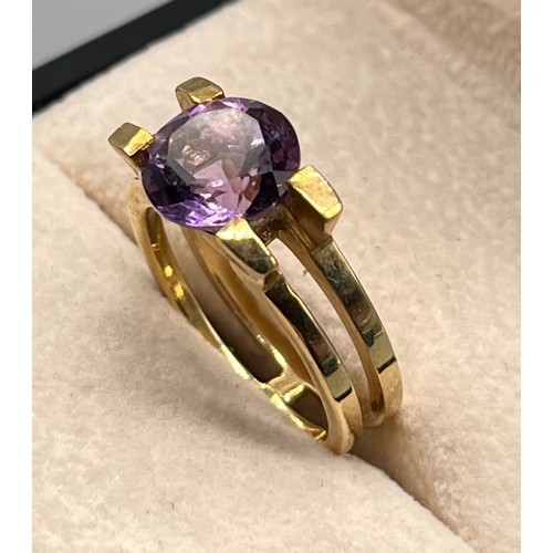 96 - 9ct yellow gold ring set with a round cut Amethyst gem stone. [Ring size M] [4.83Grams]