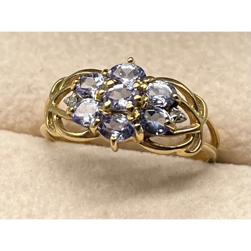 58 - 9ct yellow gold ring set with various pale purple gem stones [Ring size Q] [2.19Grams]