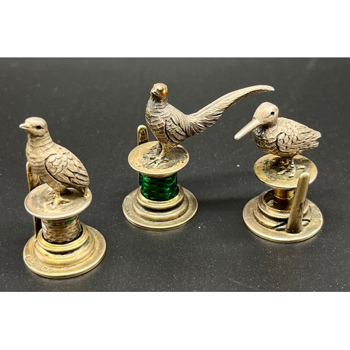 4 - Three various London silver figural bird menu/ card holders. Produced by Goldsmiths & Silversmiths C... 