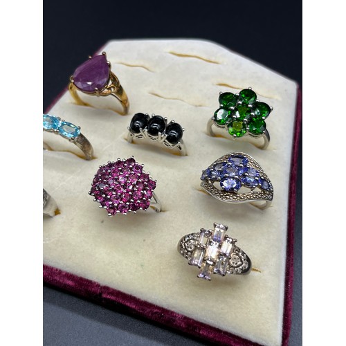 100 - A Lot of eight 925 silver and gem stone rings; Blue topaz, tourmaline and amethyst.