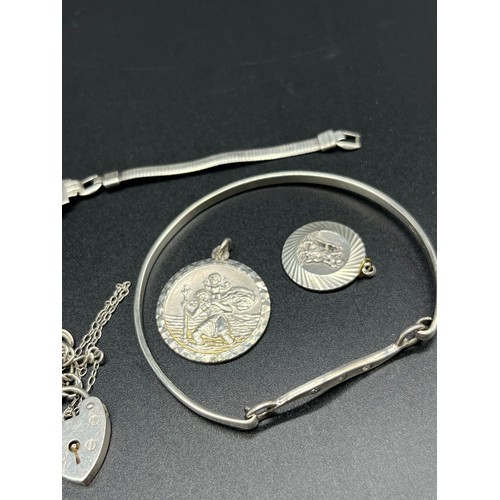 56 - Silver jewellery; Silver & CZ Stone bangle, Two Silver St Christopher Pendants by G Jensen Ltd, Pair... 