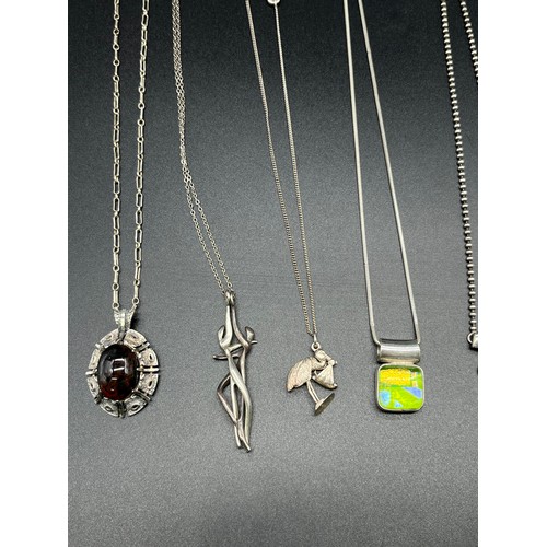 57 - A Selection of silver 925 necklaces and pendants; silver Modernist couple necklace, Murano silver pe... 