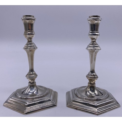 12 - A pair of cast silver George II style tapersticks
Spink & Sons, London 1968, the stem of
hexagon... 