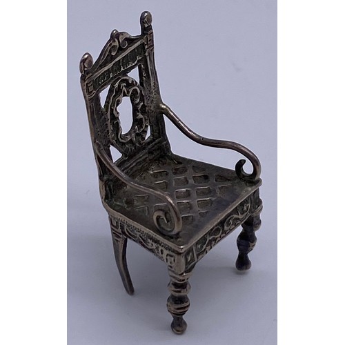 16 - A cast Chinese 19 th century miniature model
of an ornate Elizabethan inspired armchair,
carved back... 