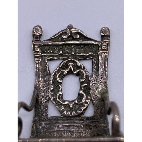 16 - A cast Chinese 19 th century miniature model
of an ornate Elizabethan inspired armchair,
carved back... 