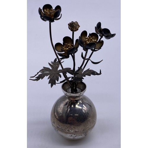 19 - A small silver vase of flowers
Pauline Dury/Gainsbury, London 1988, the
vase of spherical form, flar... 