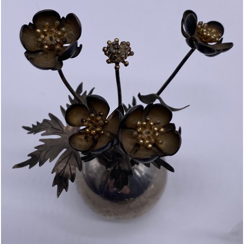 19 - A small silver vase of flowers
Pauline Dury/Gainsbury, London 1988, the
vase of spherical form, flar... 