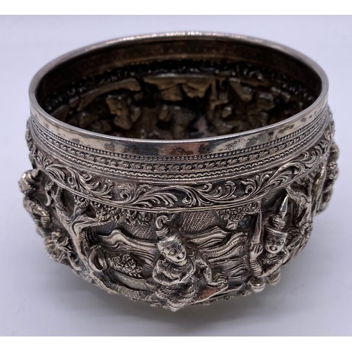 24 - A mid-19 th century Burmese silver bowl
Unmarked, all-over decoration of band of
figures
Diameter: 1... 