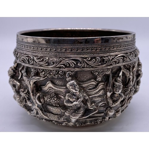 24 - A mid-19 th century Burmese silver bowl
Unmarked, all-over decoration of band of
figures
Diameter: 1... 