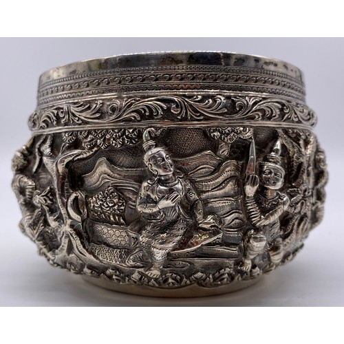 24 - A mid-19 th century Burmese silver bowl
Unmarked, all-over decoration of band of
figures
Diameter: 1... 