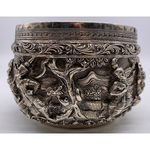 24 - A mid-19 th century Burmese silver bowl
Unmarked, all-over decoration of band of
figures
Diameter: 1... 