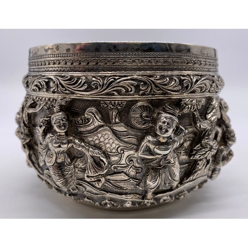 24 - A mid-19 th century Burmese silver bowl
Unmarked, all-over decoration of band of
figures
Diameter: 1... 