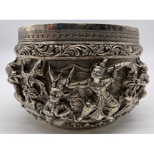 24 - A mid-19 th century Burmese silver bowl
Unmarked, all-over decoration of band of
figures
Diameter: 1... 